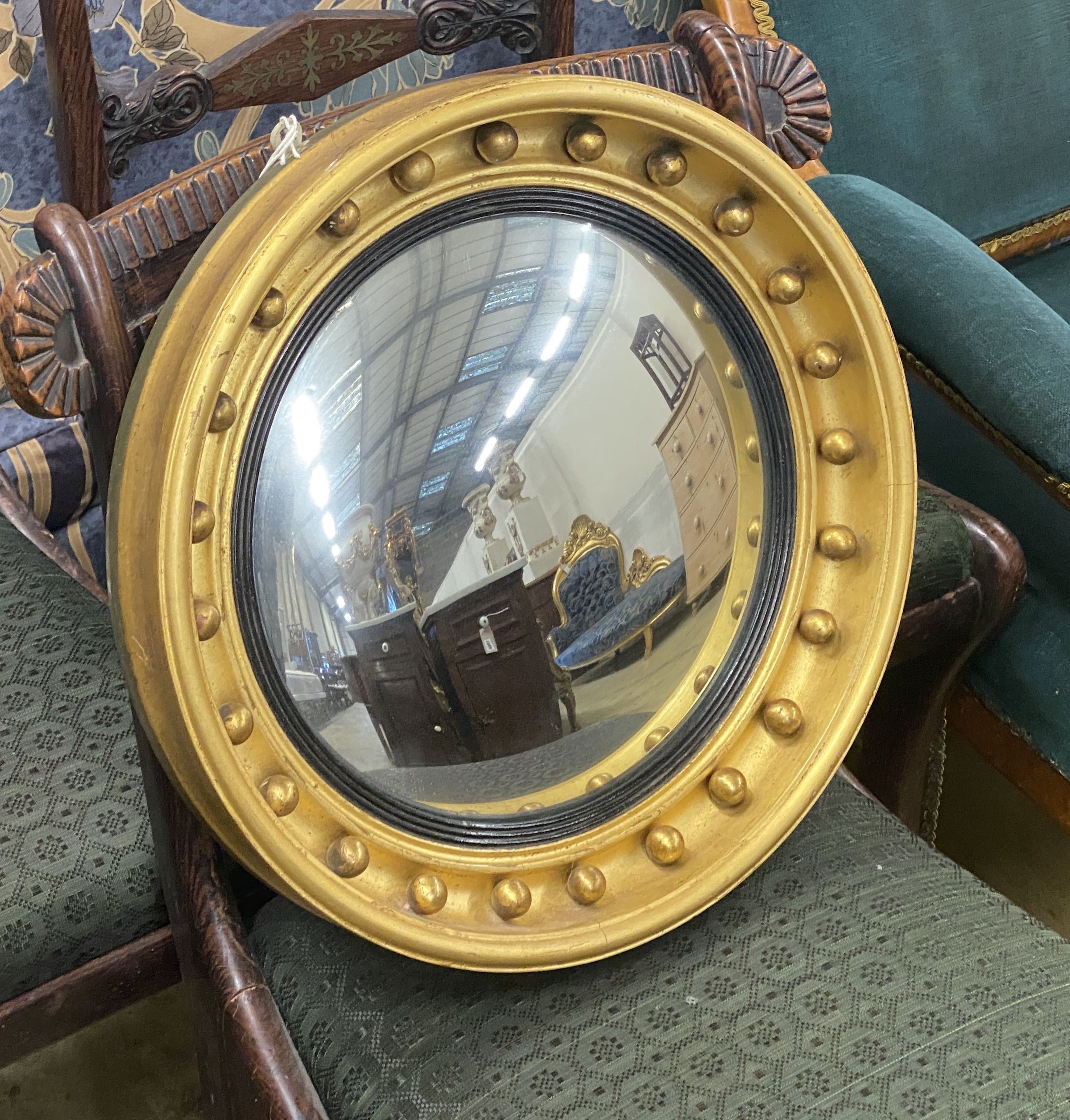 A Regency style circular gilt framed convex wall mirror, diameter 41cm